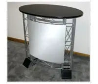 Oval countertop with a dark wood finish on a metal frame with a white fabric panel - Iconic Displays