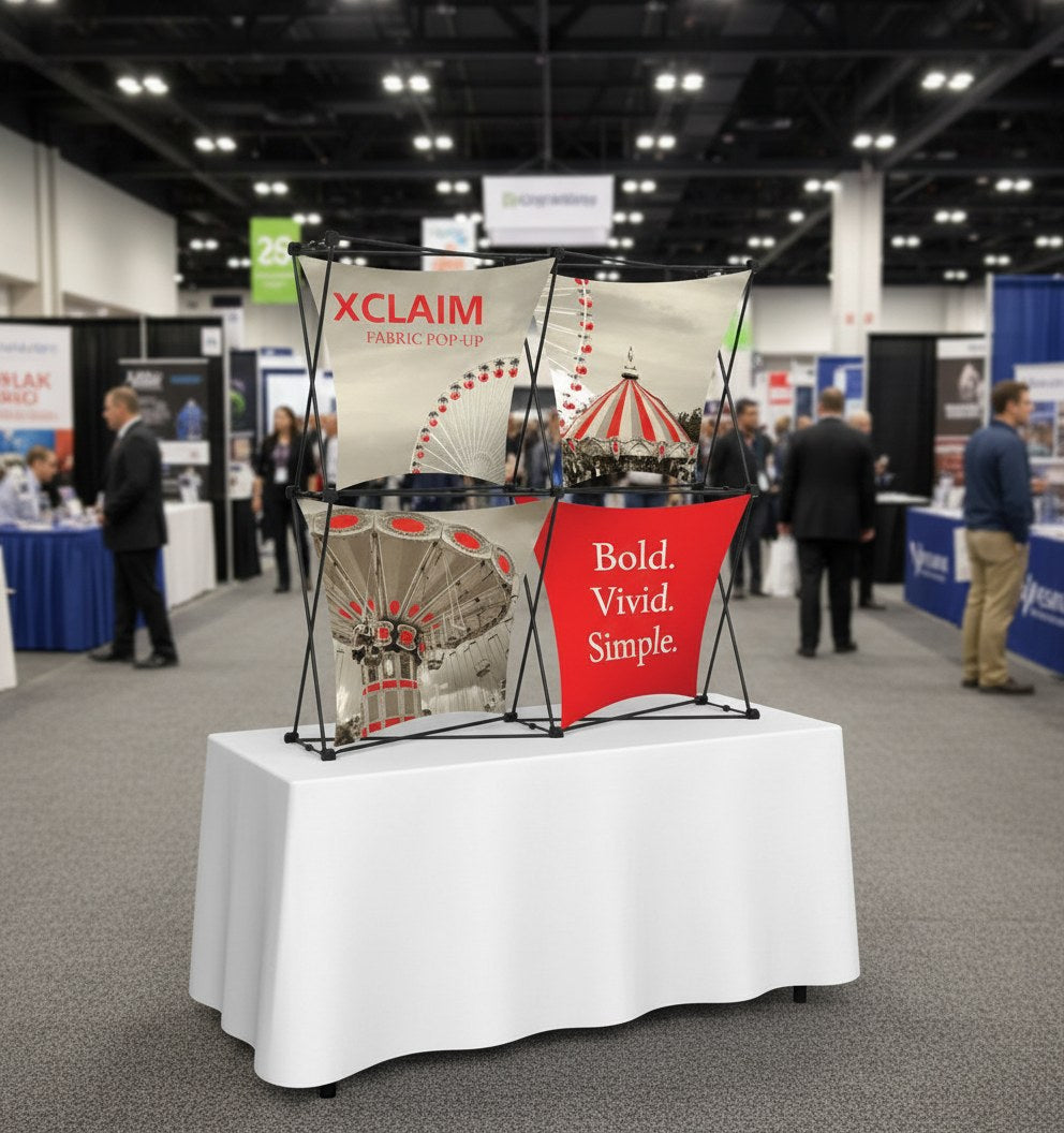 Dimensional Xclaim fabric pop up display on an exhibitor table