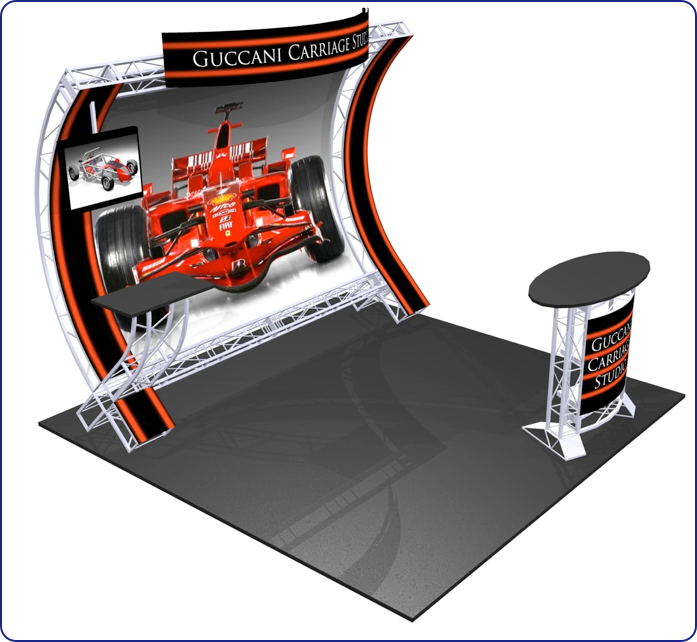 Booth with red F1 car graphic, metal frame, and "Guccani Carriage Studio" branding.